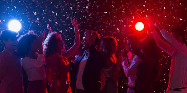 New Year's Eve Party. Happy Crowd Dancing At Nightclub, Copy Space